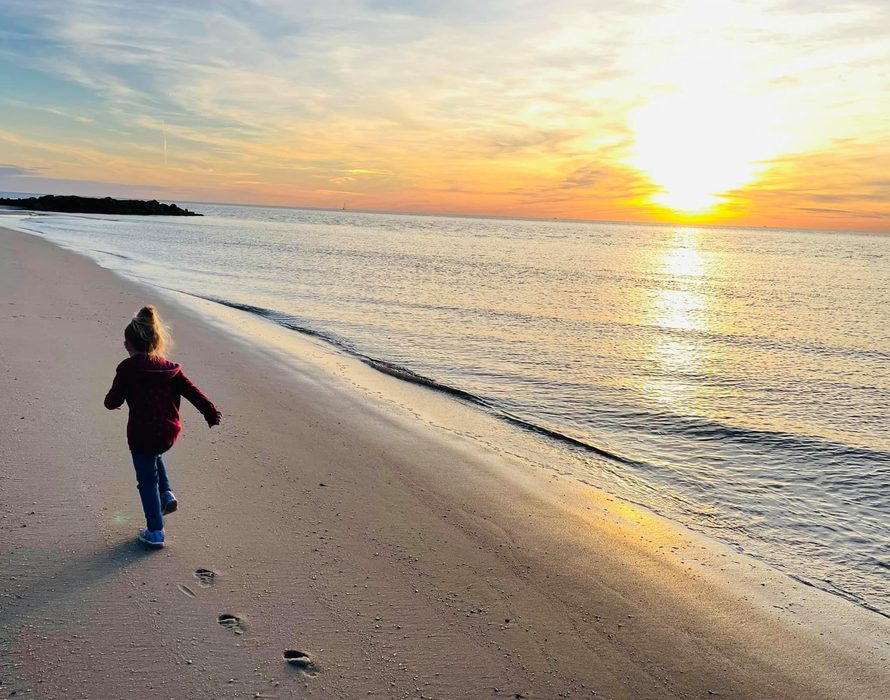Cape May County beach at sunset with Kathy's granddaughter